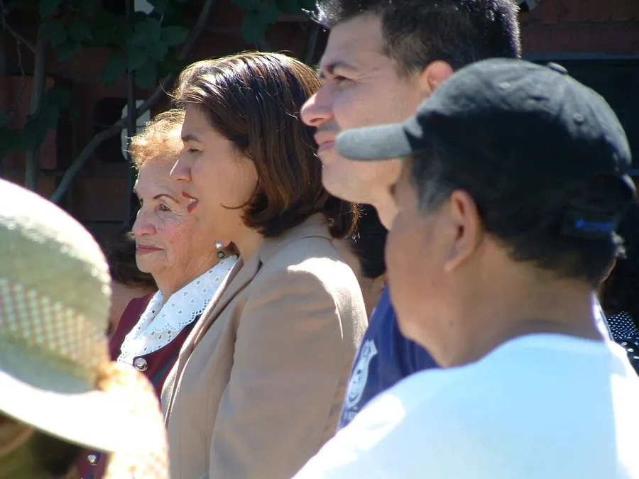 Community members listening at a rally